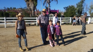 Katie with her mom and dad and friend Magie